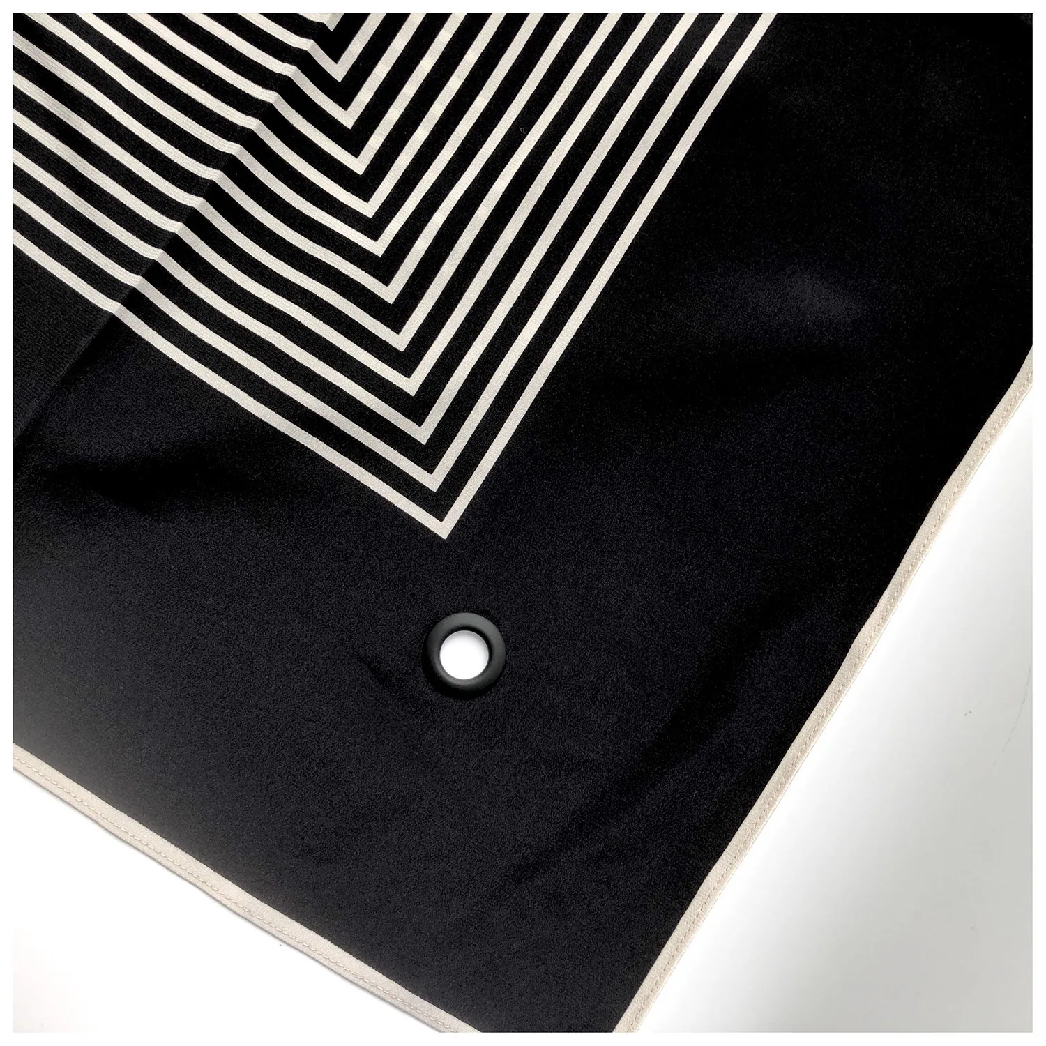 Detail view of the construction of the Modern Geometric Print 90cm Square Silk Scarf showcasing its edge finish and seam structure, designed for