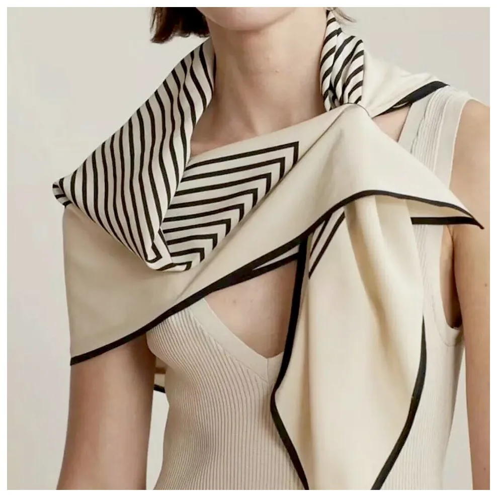 Detail view of the Modern Geometric Print 90cm Square Silk Scarf showcasing its elegant square shape, tailored seam finish, and versatile draping