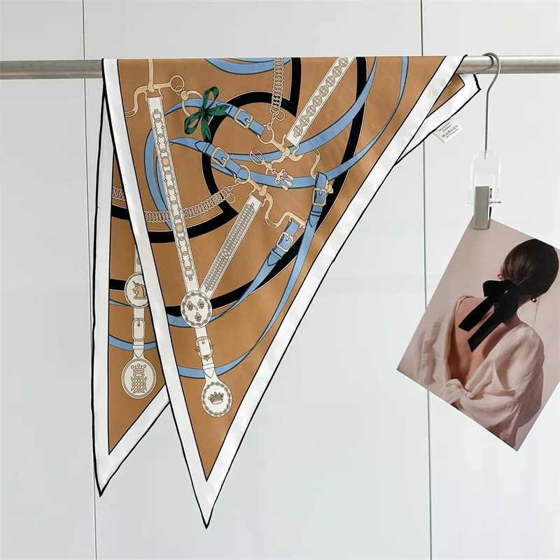 Detail view of a custom silk scarf featuring a unique triangular shape and intricate edge finish, designed for private label brands
