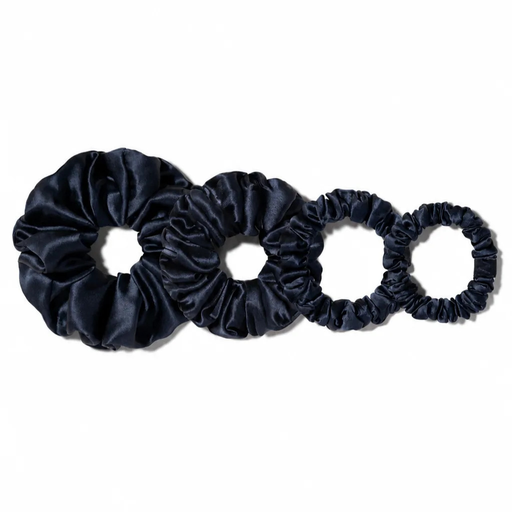 Detail view of custom silk scrunchies showcasing varied sizes and gathered construction for enhanced comfort, ideal for private label hair accessory