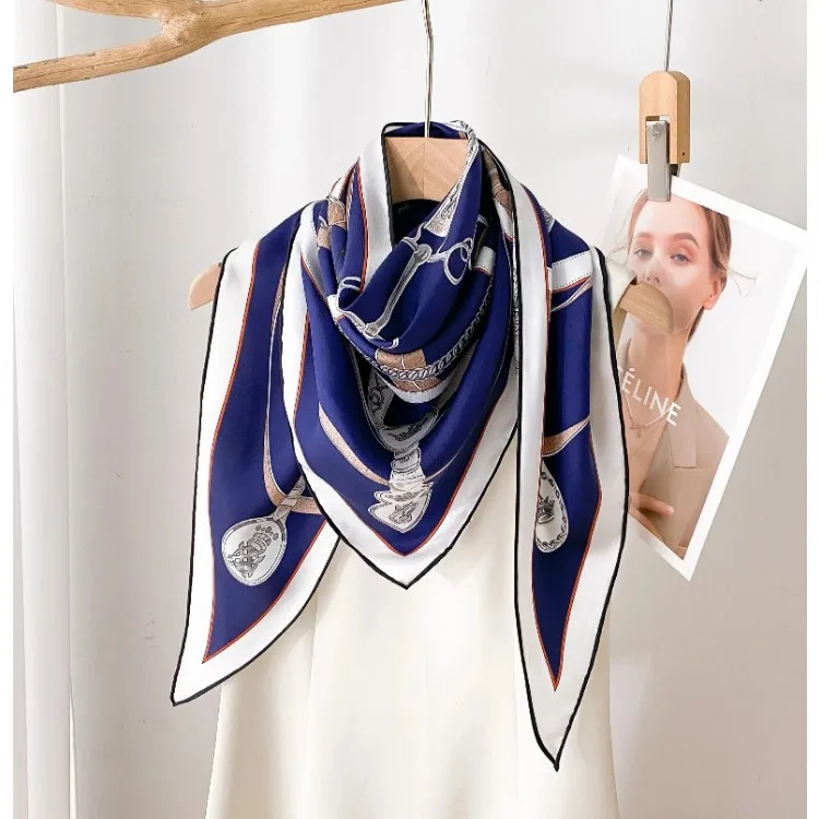 Detail view of Equestrian Chain Print Triangle Silk Scarf featuring expert tailoring, elegant edge finishes, and a versatile design suitable for