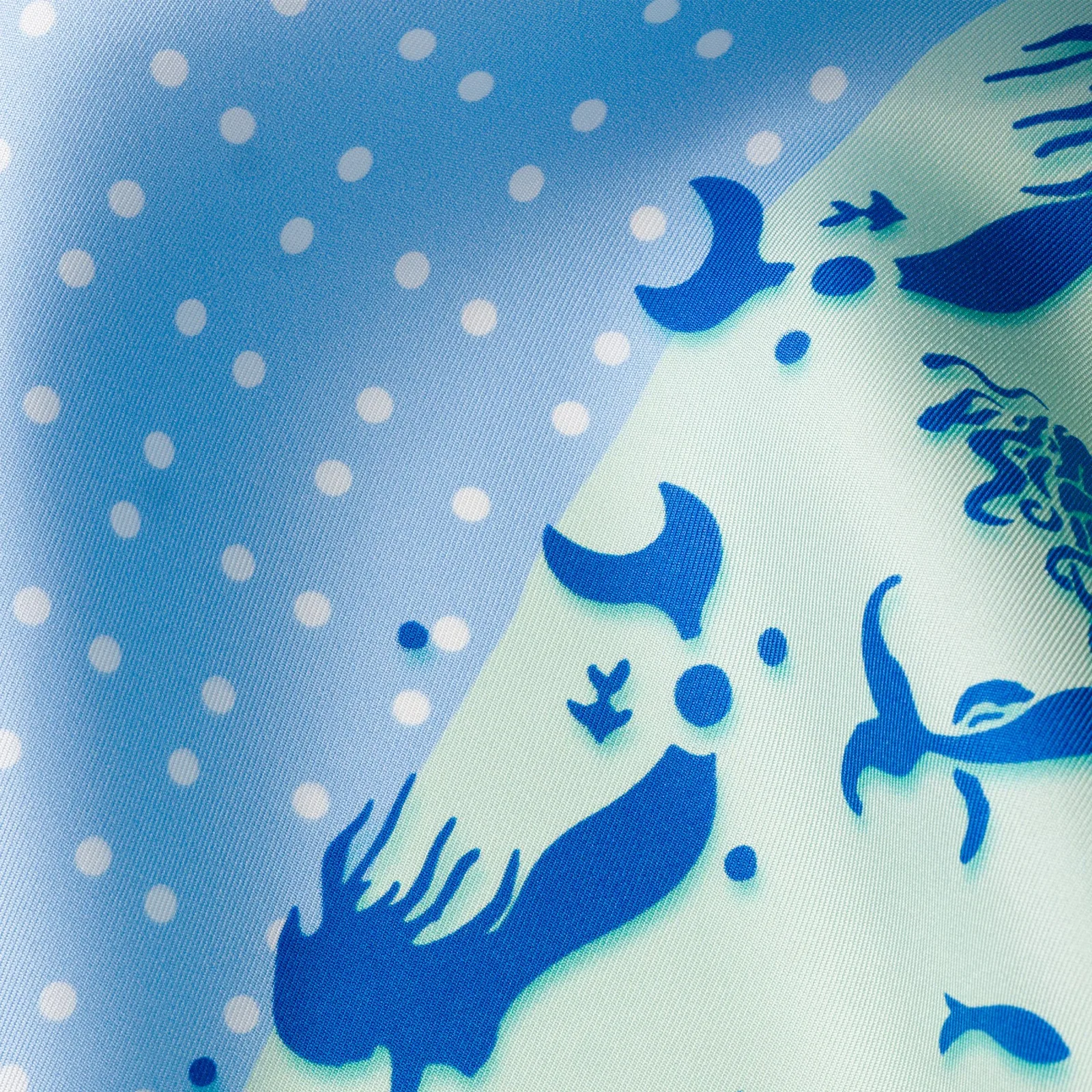 Detail view showcasing the construction and edge finish of a premium custom silk scarf, highlighting the fluid drape and comfortable fit for private