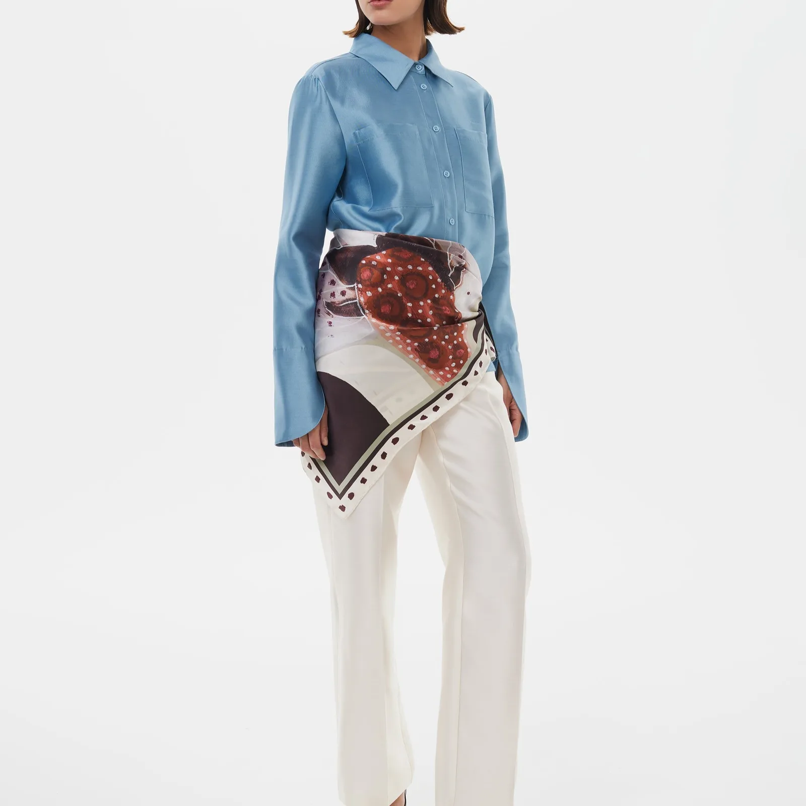 Lifestyle image showcasing a Paisley Botanical Multi-Print Silk Square Scarf, ideal for private label fashion and gift brands