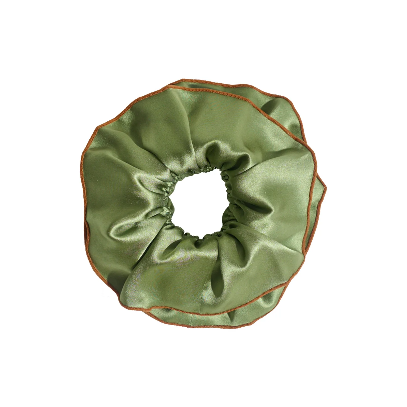 Detail view of a custom silk scrunchie with a ruffled edge and contrasting trim, designed for private label hair accessory brands