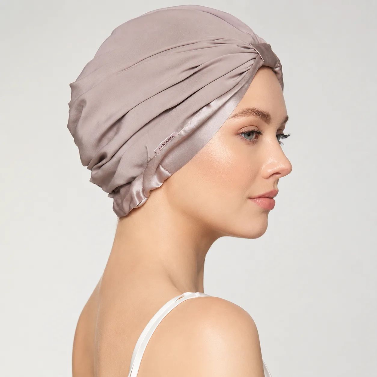 Detail view showcasing the unique silhouette and structure of a custom silk sleep cap, designed for comfort and secure fit for hair care brands