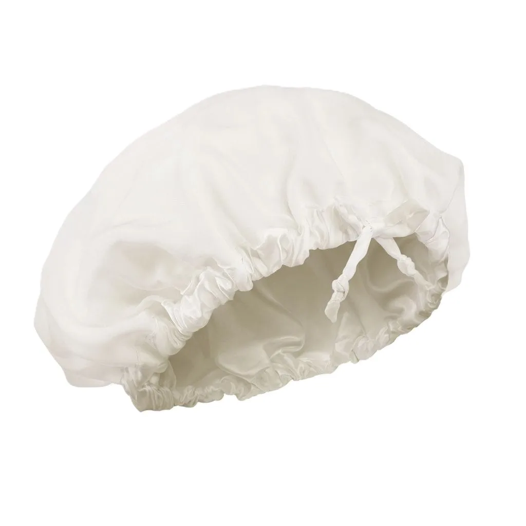 Detail view of custom silk sleep cap showcasing gathered elastic closure for a secure and comfortable fit, tailored for private label beauty brands