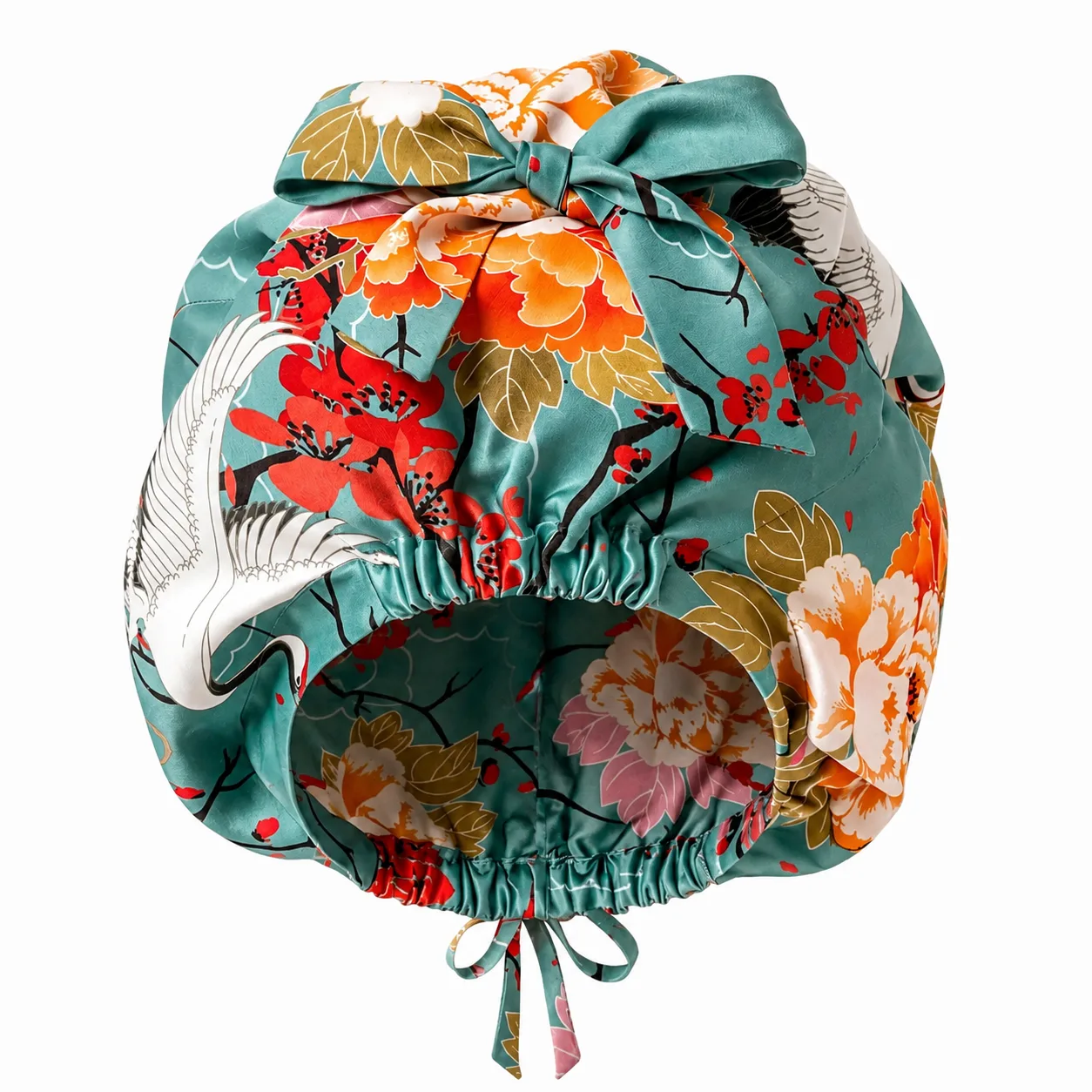 Detail view of a custom silk sleep cap with gathered construction and adjustable fit, designed for comfort and style in hair care applications