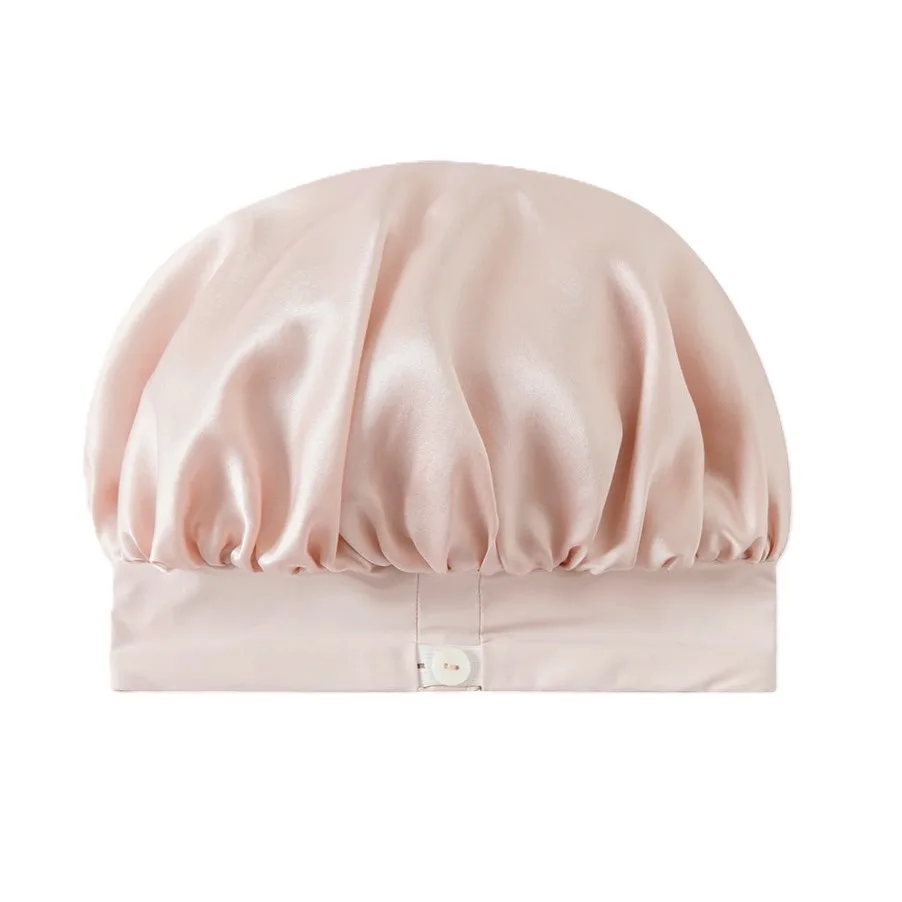 Detail view of a custom silk sleep cap, featuring a soft, gathered design and adjustable band for comfort, ideal for private label hair care brands
