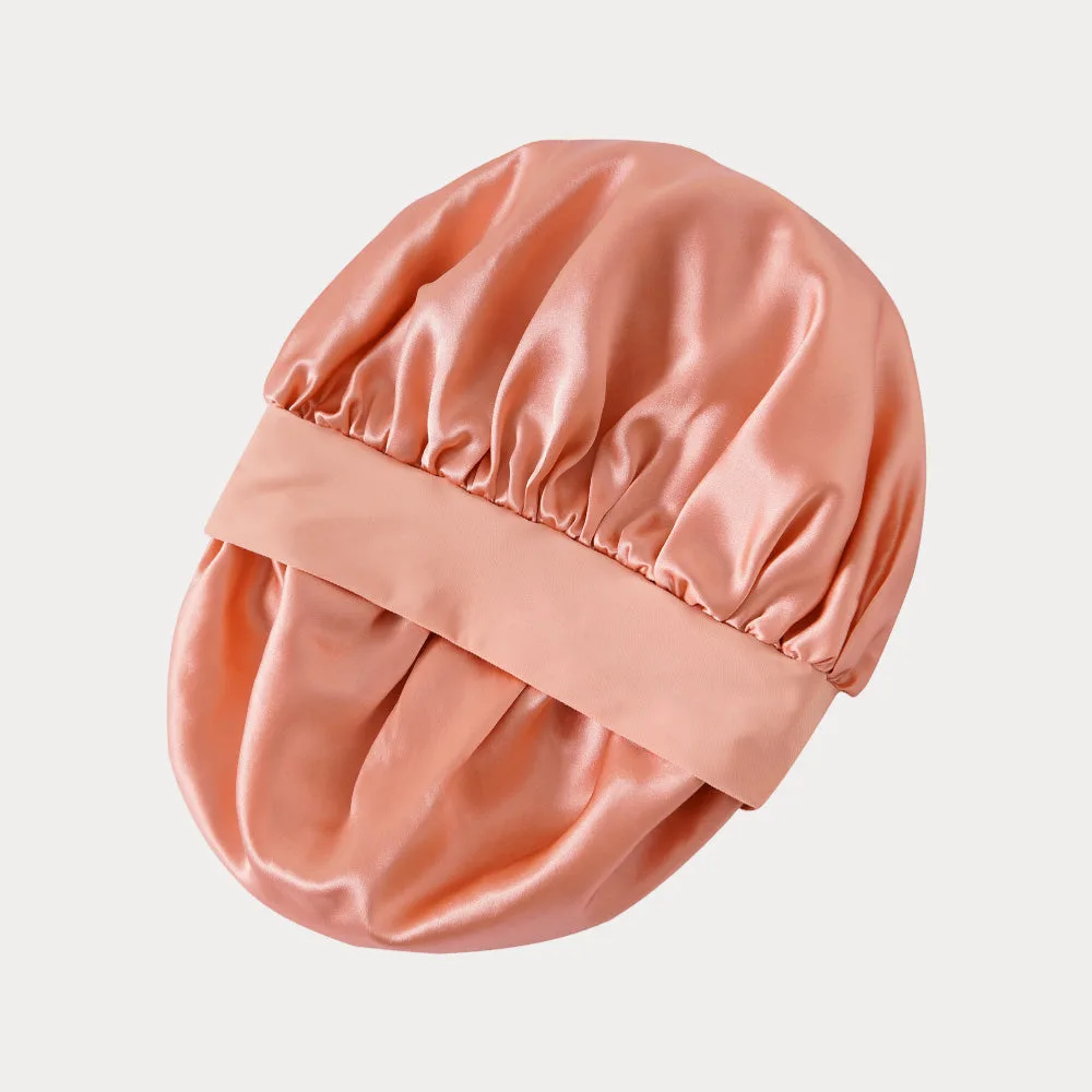 Detail view of custom silk sleep cap featuring gathered construction for a secure fit, designed for optimal comfort during hair care routines