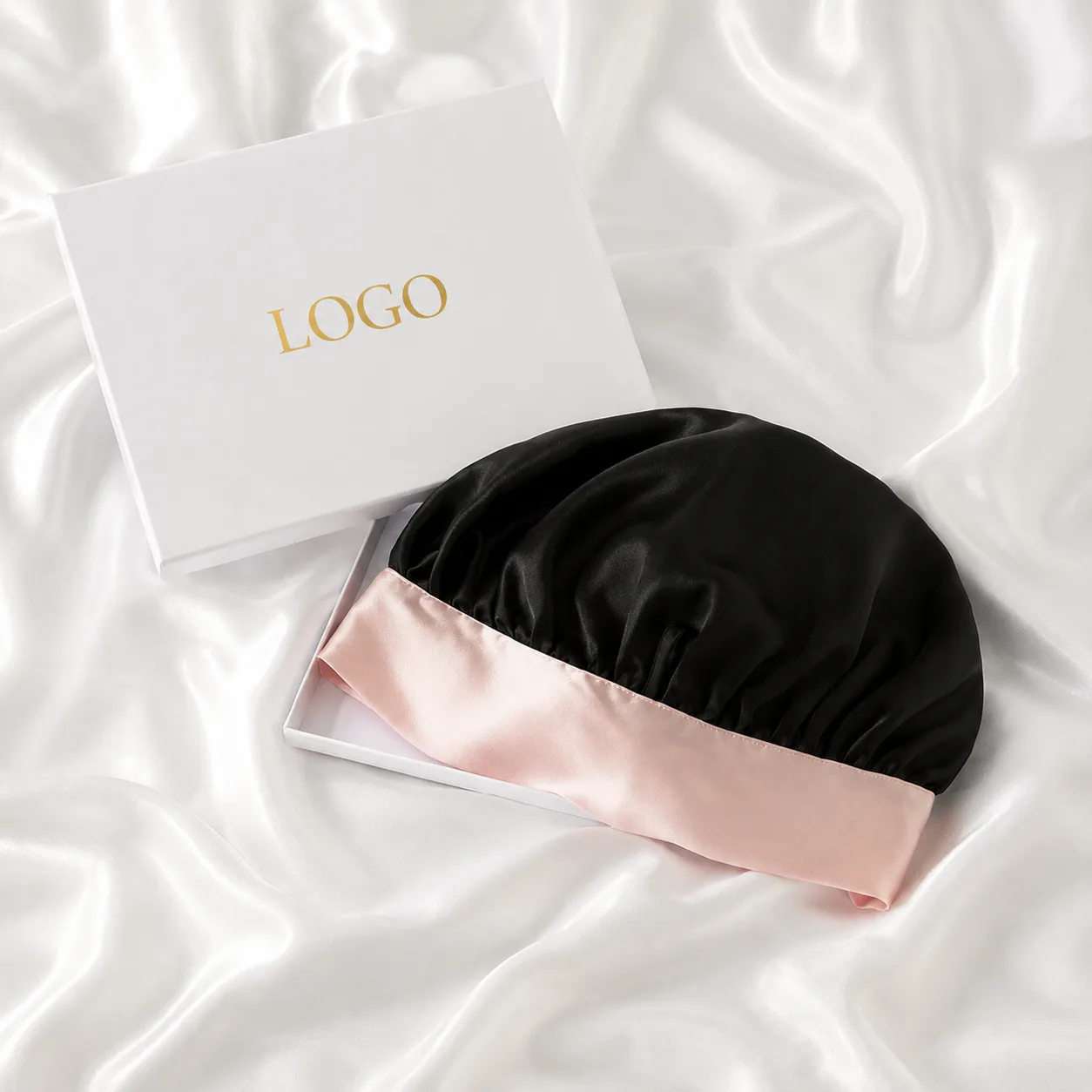 Detail view of custom silk sleep cap showcasing gathered construction and contrasting edge finish for optimal comfort and fit, designed for private