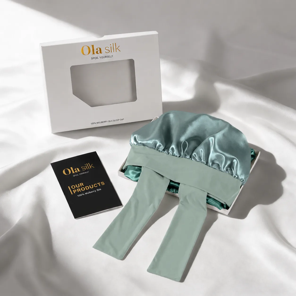Detail view of custom silk sleep cap showcasing its structured design, featuring a comfortable elastic fit and elegant edge finish, ideal for beauty