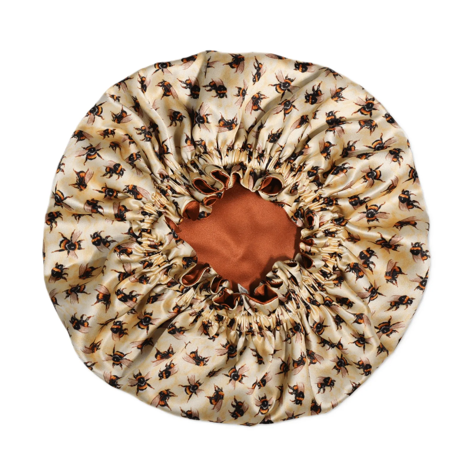 Detail view of a custom silk sleep cap showcasing its gathered elastic band design for a secure fit, emphasizing comfort and functionality for hair