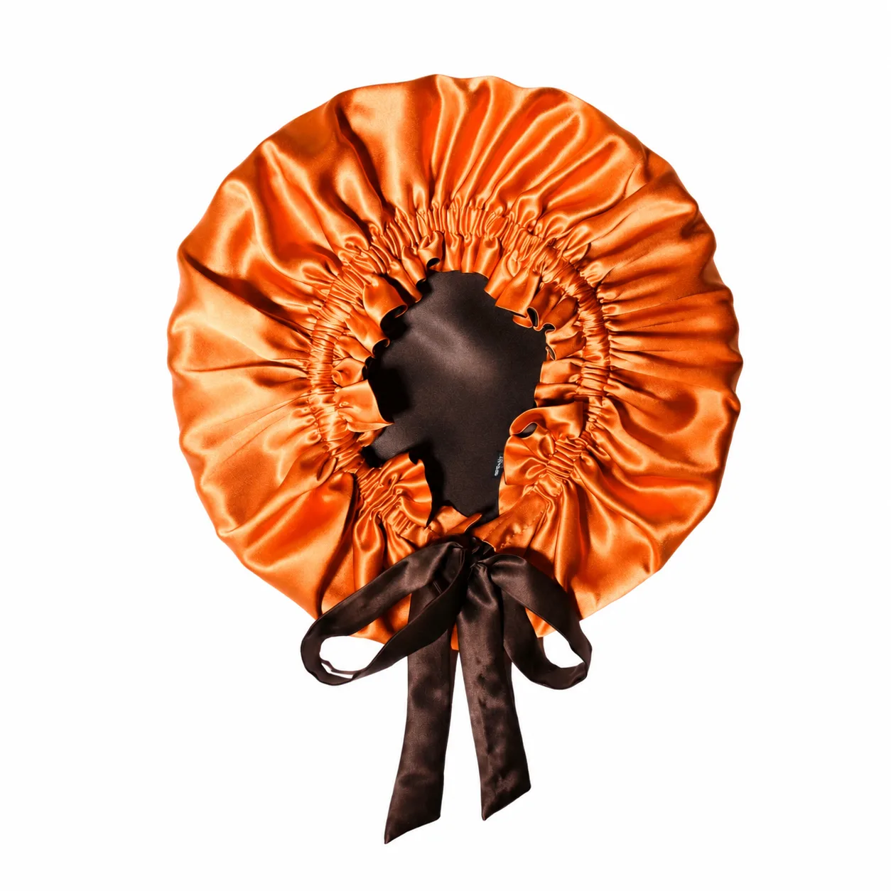 Detail view of a custom silk sleep cap with gathered edges and satin finish, designed for optimal comfort for beauty brands