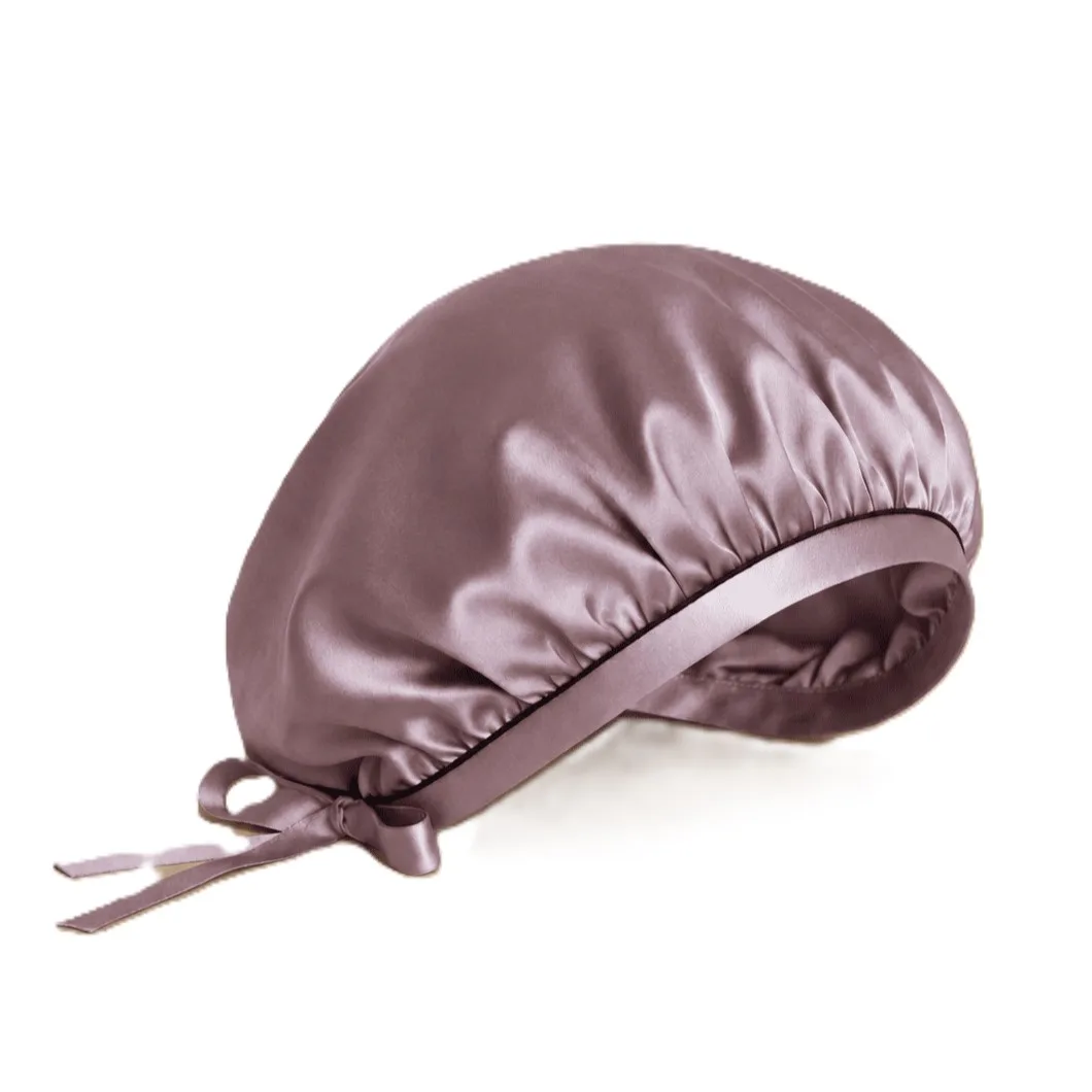 Detail view of a custom silk sleep cap featuring a gathered construction and adjustable strap, designed for comfort and secure fit for beauty brands