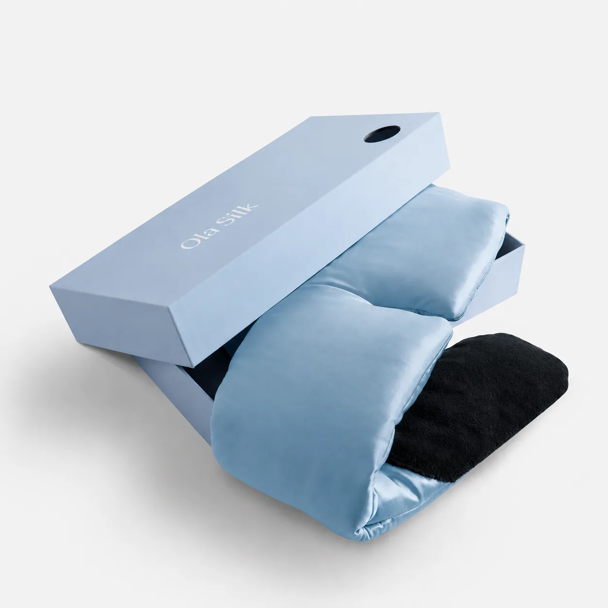 Detail view of a custom silk sleep mask featuring a contoured shape and plush padding for enhanced comfort, designed specifically for private label