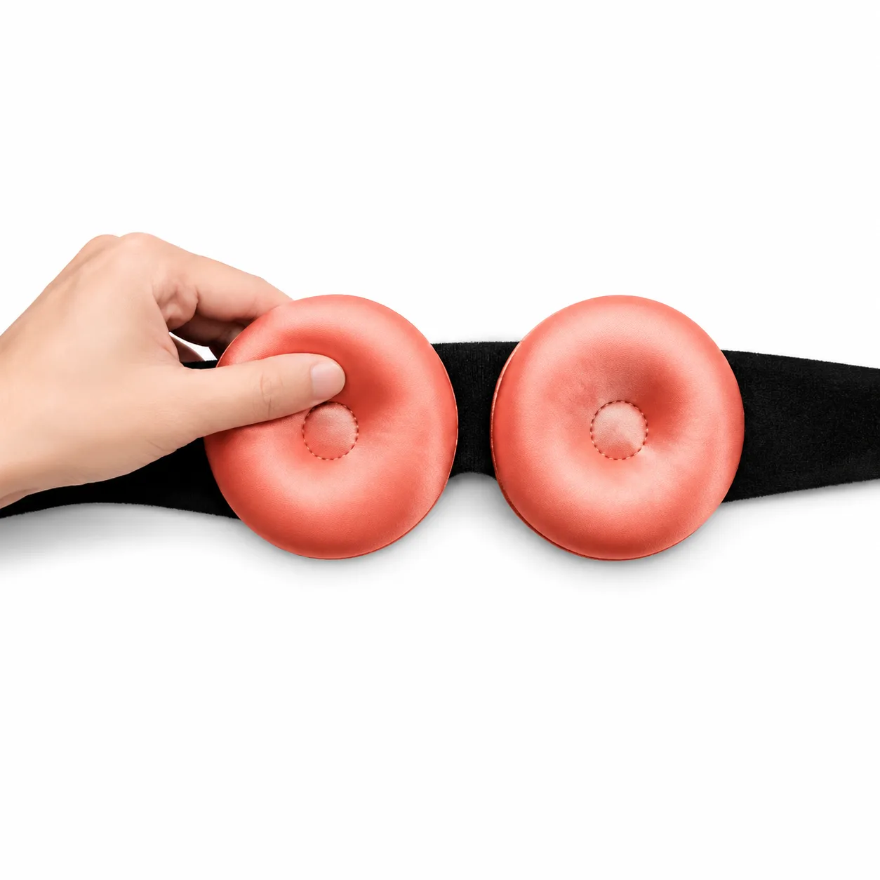 Detail view of the custom silk sleep mask with contour design, featuring padded eye cups for enhanced comfort and a soft band for secure fit, tailored