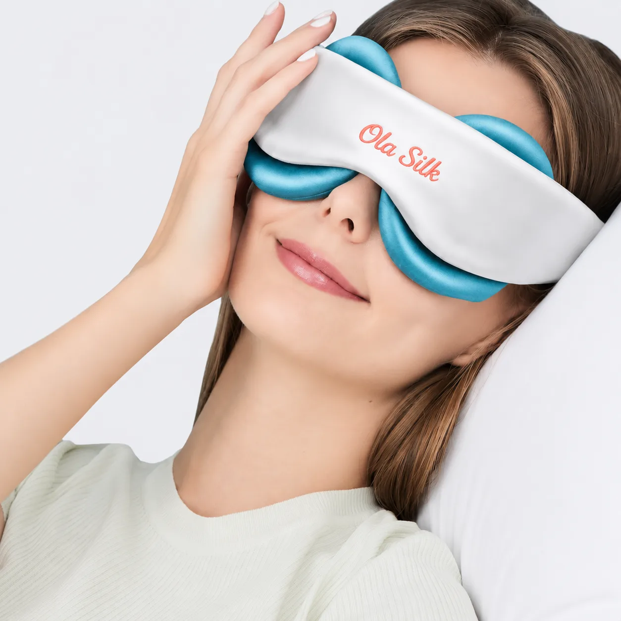 Detail view of custom silk eye mask featuring a contoured design for enhanced comfort, with smooth edges and an adjustable strap for a secure fit