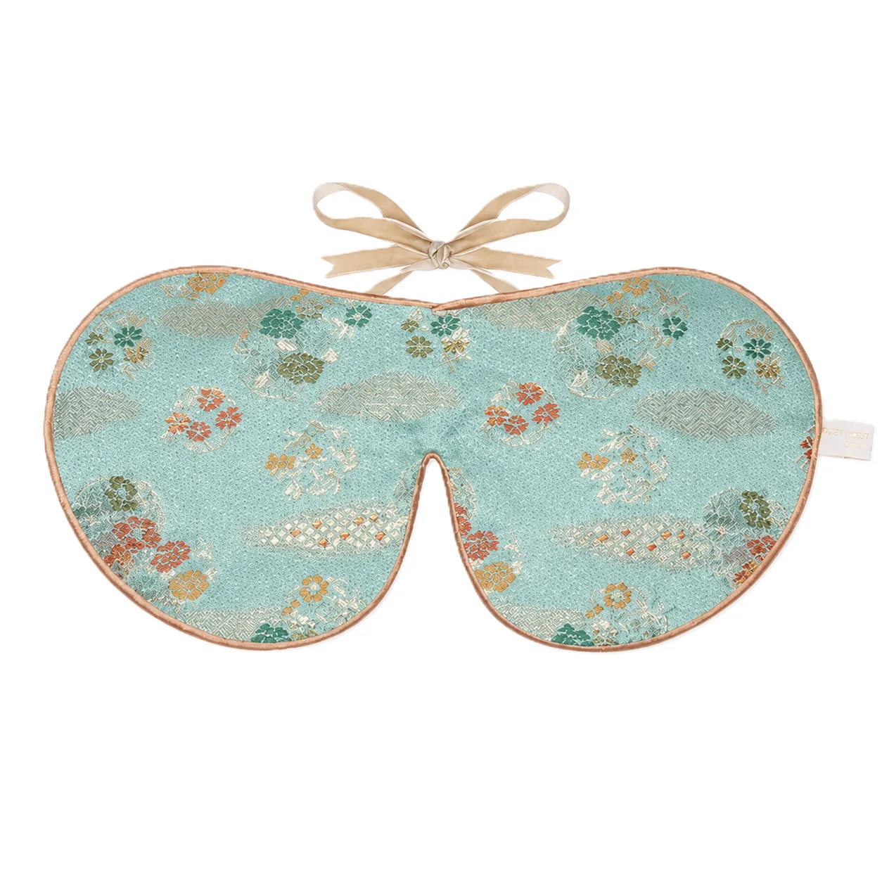 Detail view showcasing the customized shape and construction of a private label silk sleep mask designed for comfort, featuring padded edges and a