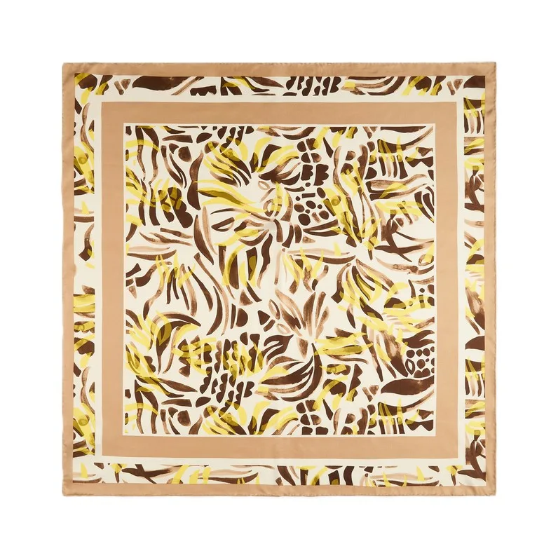 Detail view of custom silk scarf showcasing vibrant floral design, featuring precise edges and seamless construction for added comfort and style