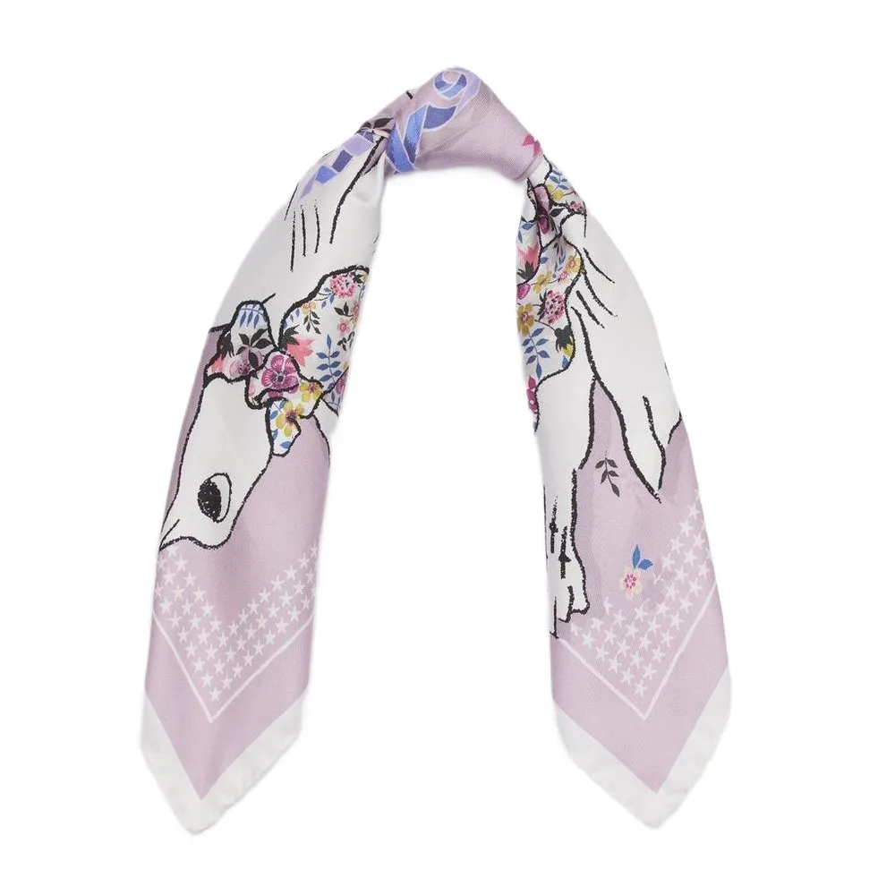 Detail view of the custom silk scarf featuring a floral design and a diagonal edge finish, crafted for private label brands