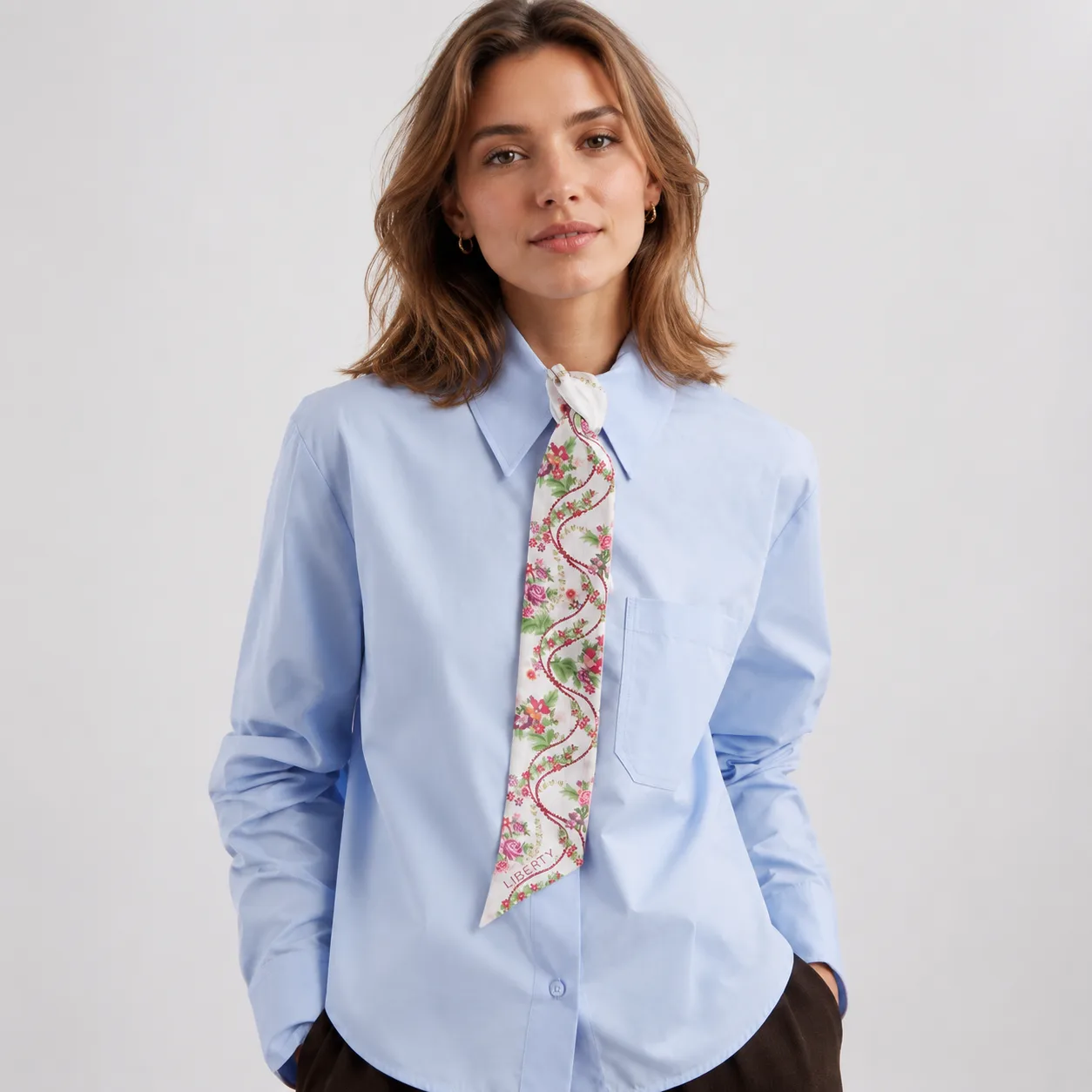 Detail view showcasing the elegant construction of a custom silk tie, emphasizing its unique shape, refined edges, and comfortable fit, ideal for
