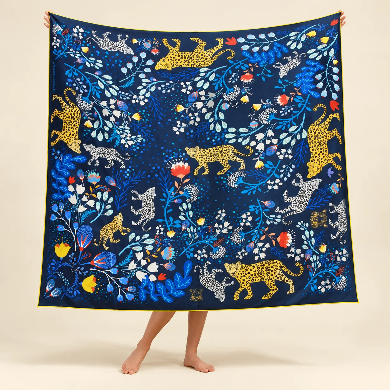 Detail view showcasing the shape and construction of a custom silk scarf, featuring a neatly finished edge that enhances durability and ensures