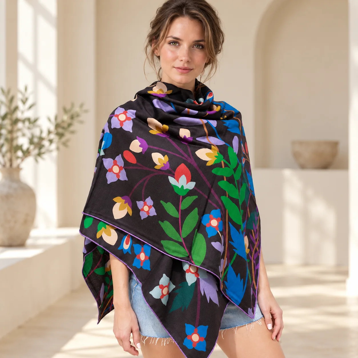 Detail view showcasing the construction and fit of a custom silk shawl, highlighting its drape, edge finish, and versatile wear options for private