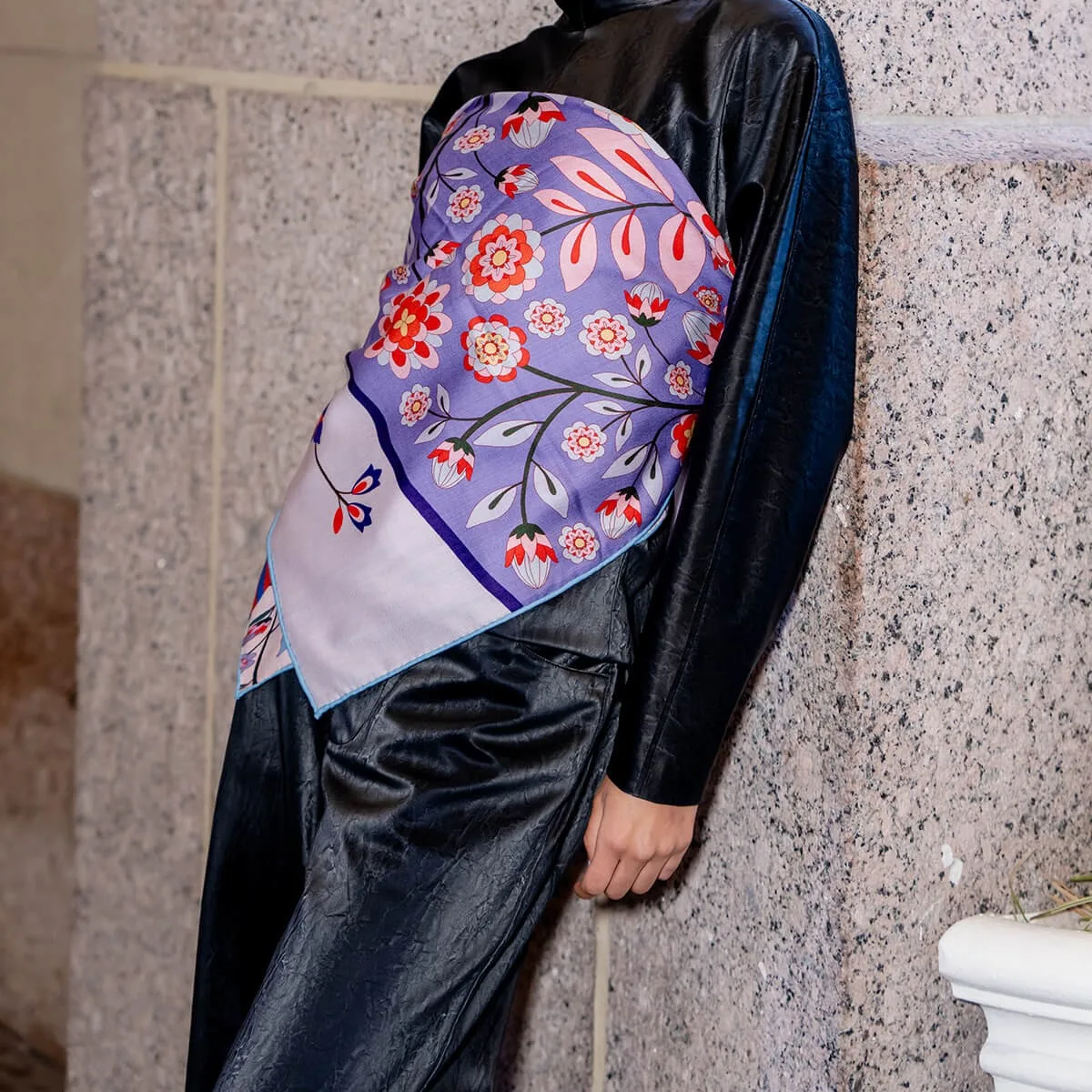 Detail view of custom Navy Animal Print Wool Silk Square Scarf showcasing unique floral and animal patterns, emphasizing a tailored edge finish and