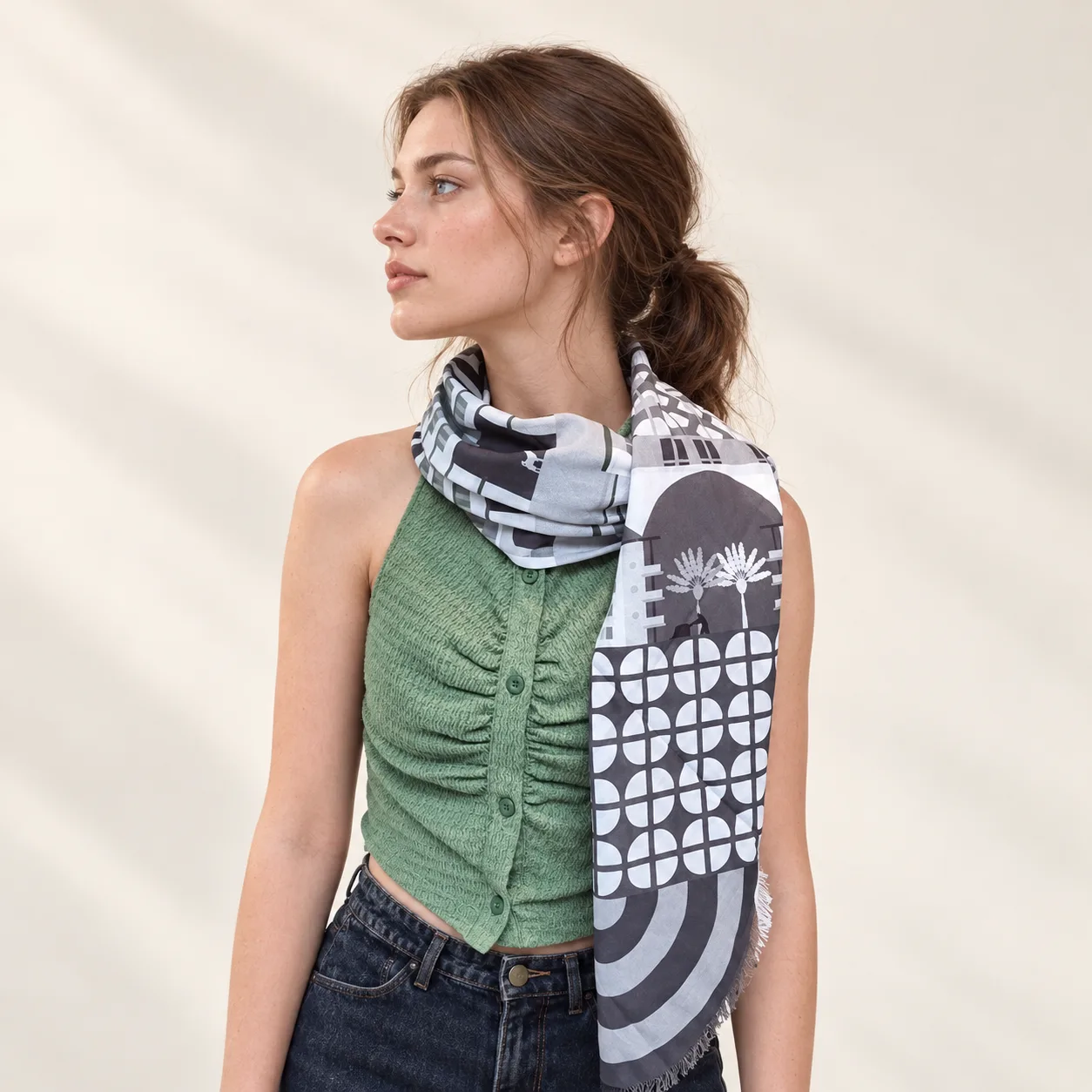 Detail view of a custom silk scarf showcasing its soft drape and versatile silhouette, tailored for private label fashion brands